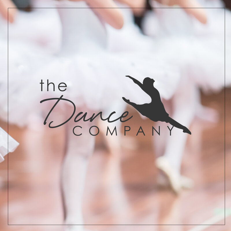 The Dance Company logo over a soft photo of dancers in tutus